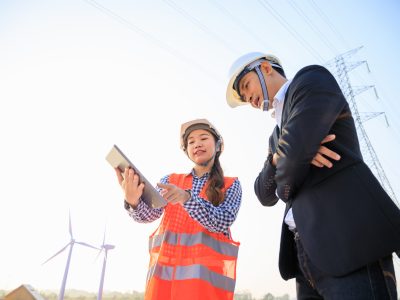 Engineers evaluating construction plans on site